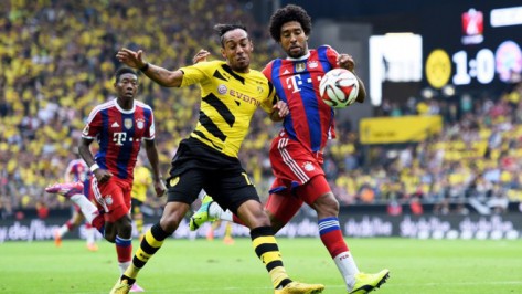 Pierre-Emerick Aubameyang of Dortmund and Dante of Munich compete for the ball photo credit ar.fifa.com